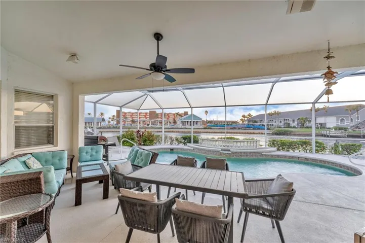 View of patio / terrace featuring outdoor lounge area, a pool with hot tub, ceiling fan, and a lanai