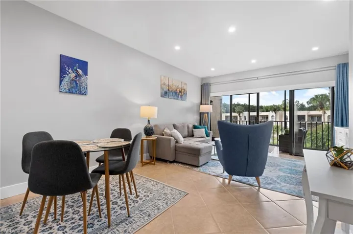 Dining space featuring recessed lighting and light tile patterned floors