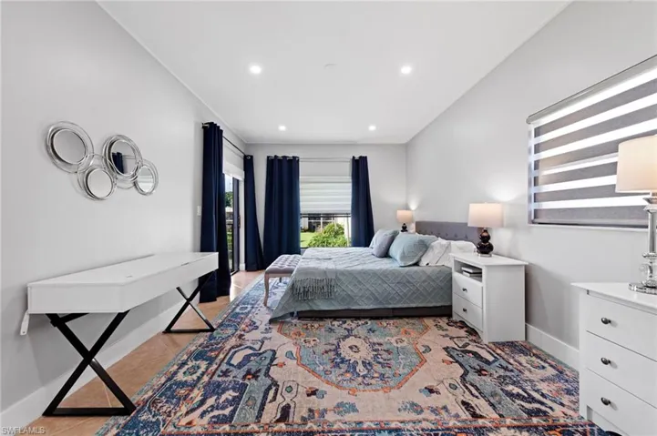 Bedroom with recessed lighting and light tile patterned flooring