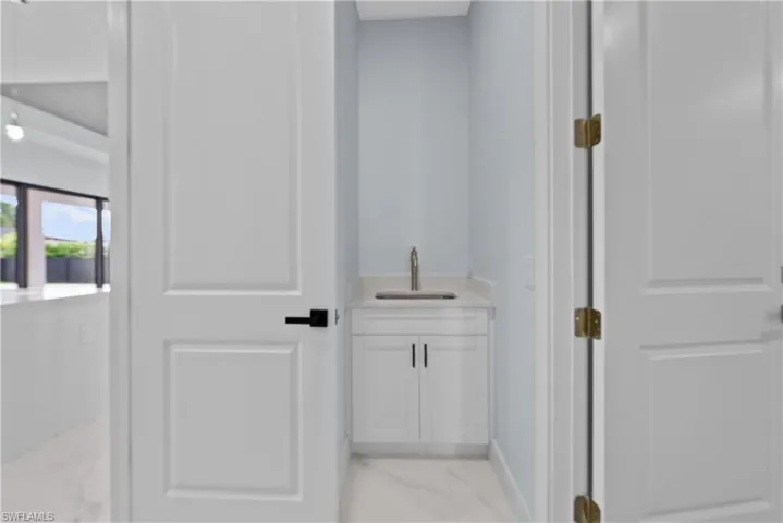 Bathroom featuring tile floors and vanity