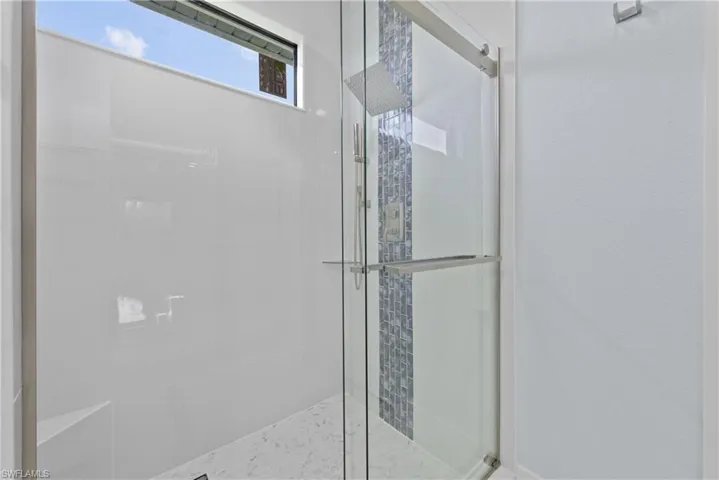 Bathroom with a shower with door