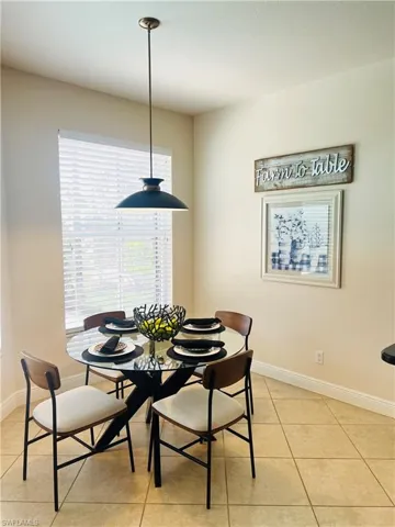 Dining area featuring light tile patterned floors