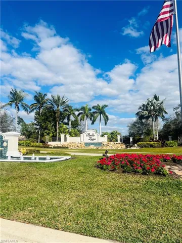 View of home's community with a yard