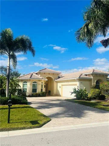 Mediterranean / spanish-style home featuring a garage