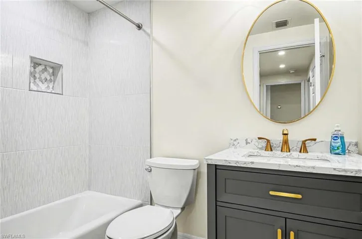 Full bathroom featuring vanity and bathtub / shower combination