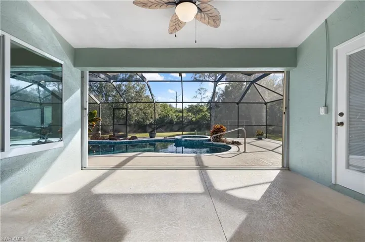 View of swimming pool with ceiling fan