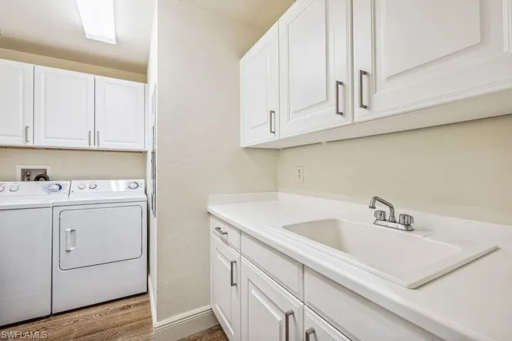 In Residence Laundry Room with Sink and Storage