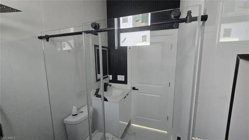 Bathroom featuring vanity and a walk in shower
