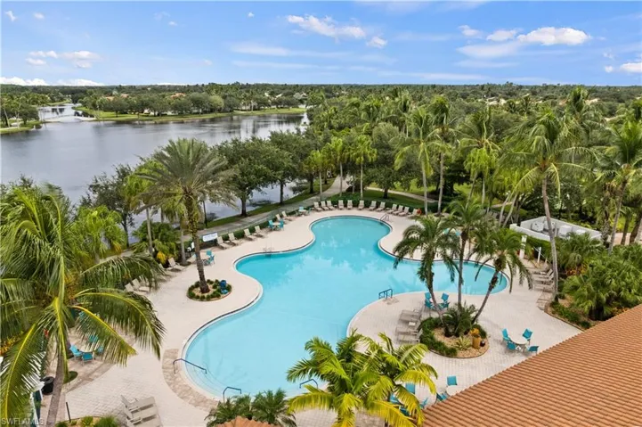 View of pool with a water view and a patio area