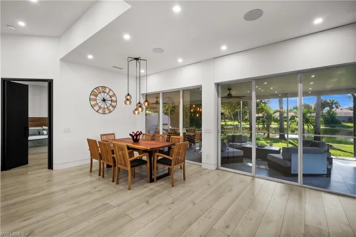 Dining space with light hardwood / wood-style flooring