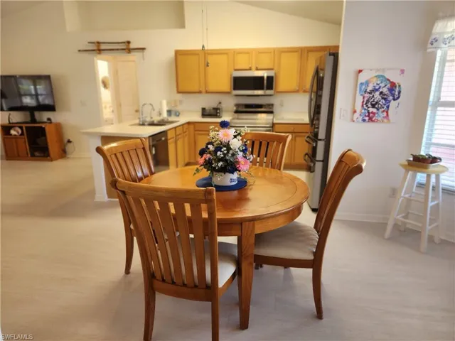 Dining area with lofted ceiling