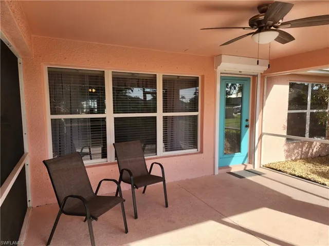 View of oversized lanai featuring a ceiling fan