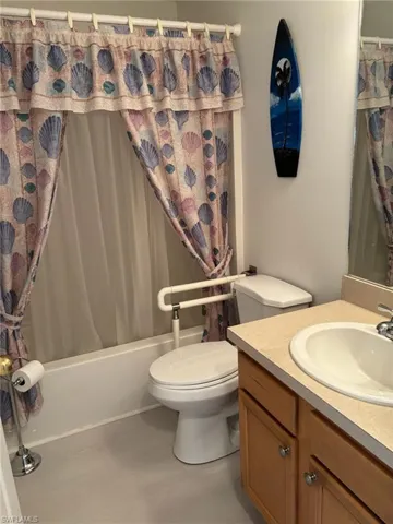 Full bath with vanity and shower / bathtub combination with curtain