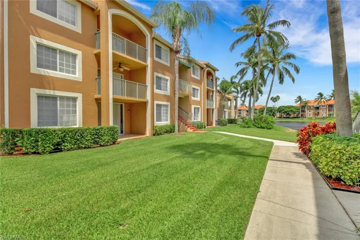 View of apartment building / complex with a water view