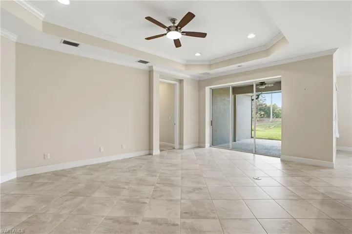 Living area with view of patio- Virtually enhanced