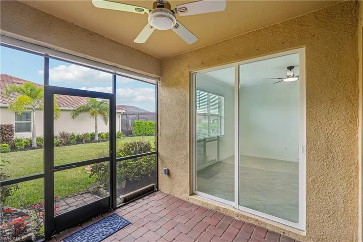 Unfurnished sunroom with a ceiling fan