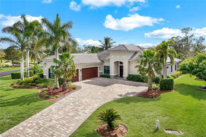 Graceful palm trees frame the house greeting you as you drive up on the extended paved  driveway.