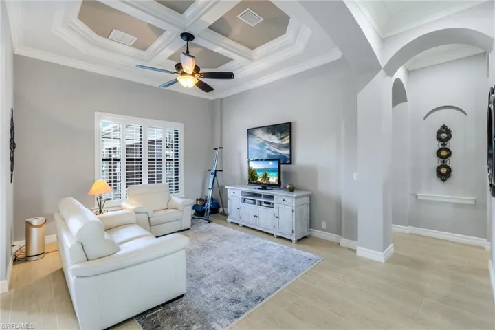 This flex space offers endless possibilities, whether used as a dining room, sitting area, fitness room, or den/office. Shown here as an additional living room.