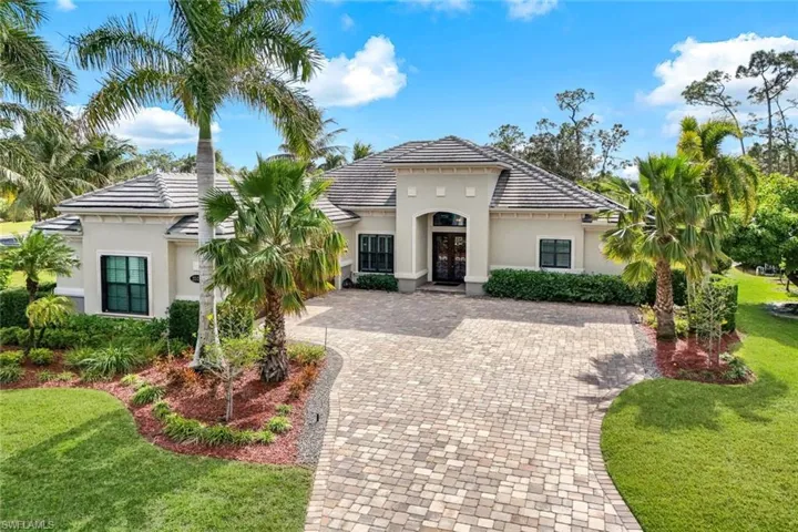 Mediterranean / spanish home featuring a front yard
