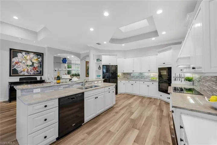 This large, cheery kitchen opens up to the bar and family room, and has amazing views!