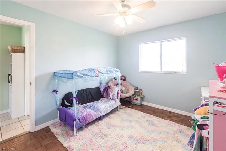 Bedroom with baseboards and ceiling fan