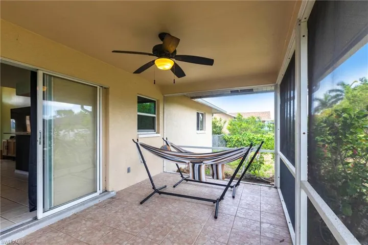 Sunroom featuring ceiling fan