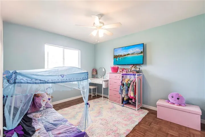 Bedroom featuring baseboards and ceiling fan
