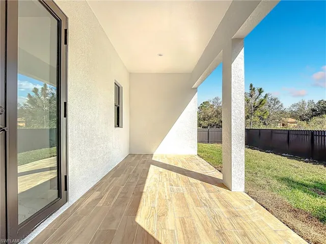 Fenced backyard featuring a patio