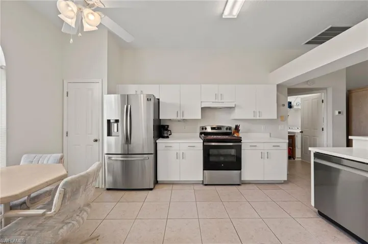 Expansive Kitchen with Stainless Steel Appliances