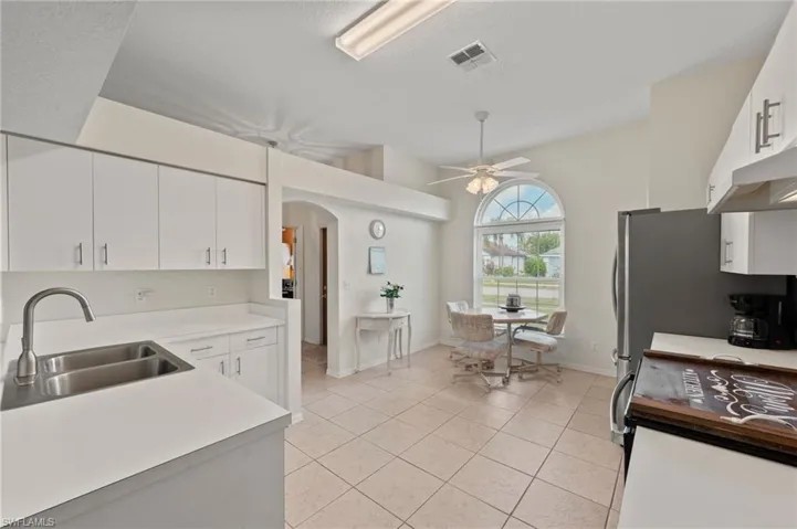 Expansive Kitchen with Stainless Steel Appliances