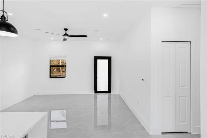 Spare room featuring light marble finish flooring, recessed lighting, and ceiling fan