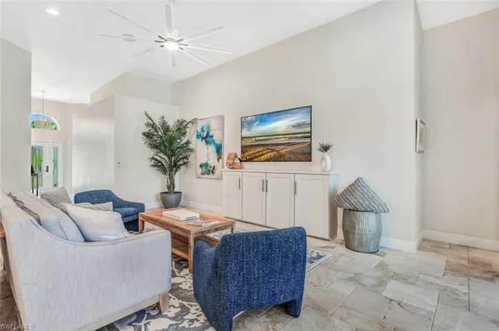 Tiled living room with ceiling fan