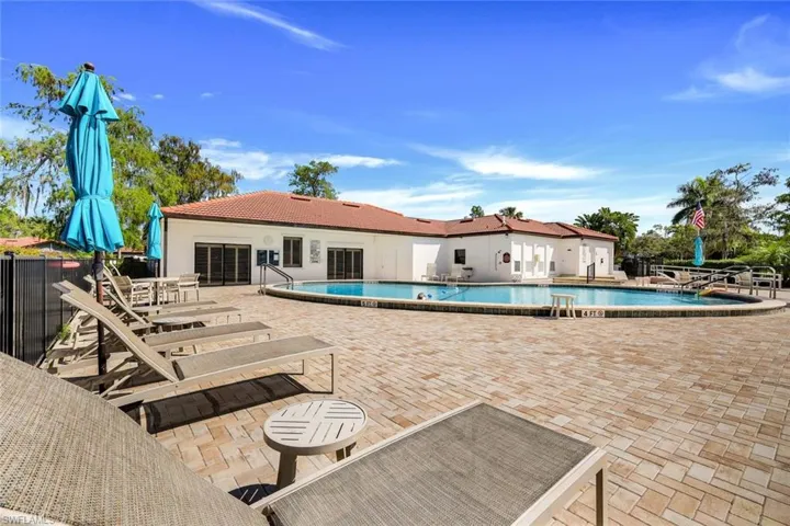 Community pool with a patio area