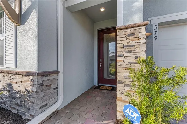 Entrance to property with a garage