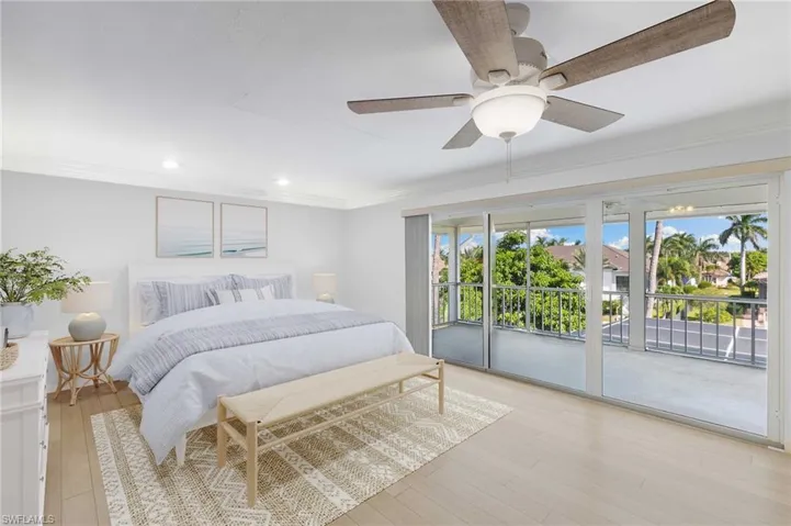 Virtually Staged - Bedroom with access to exterior, ornamental molding, light wood-style flooring, ceiling fan, and recessed lighting