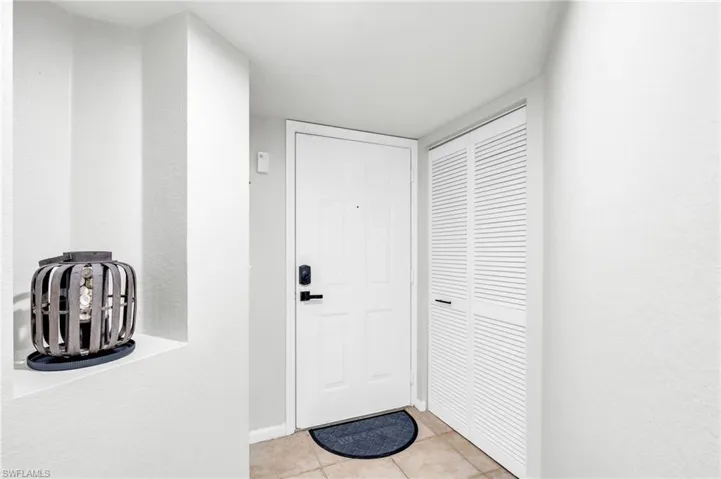 Entryway featuring light tile patterned floors