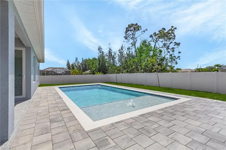 View of swimming pool featuring a patio, a fenced backyard, and a fenced in pool