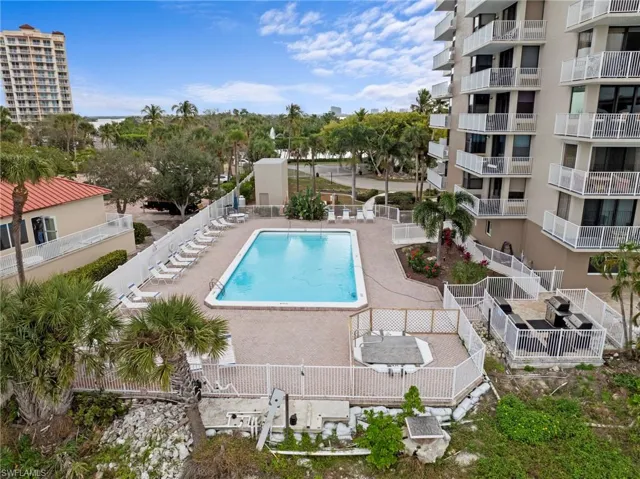 Community pool featuring a patio