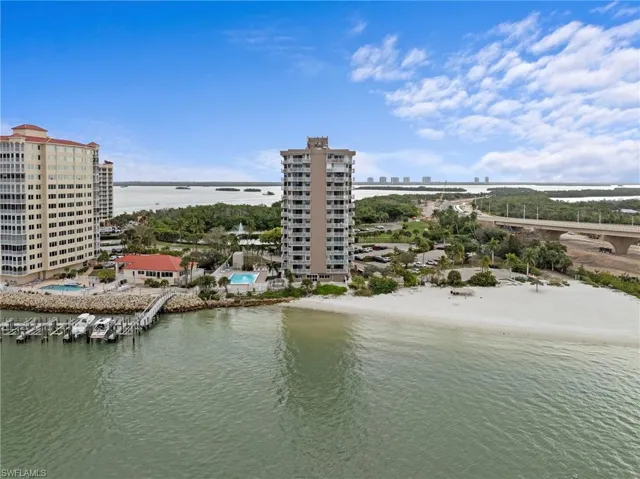 Water view featuring nearby urban area and a notable bridge