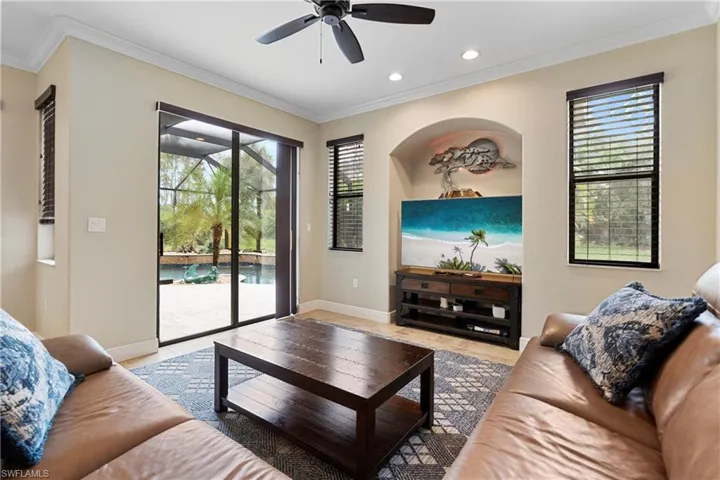 Fmily room with ceiling fan and a healthy amount of sunlight