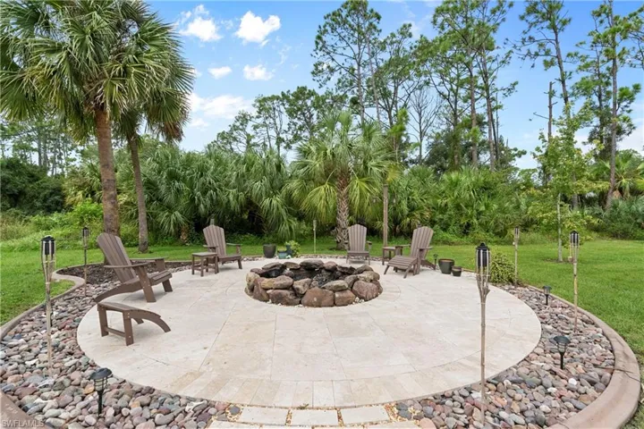View of patio featuring an outdoor fire pit