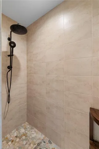 Bathroom featuring a tile shower
