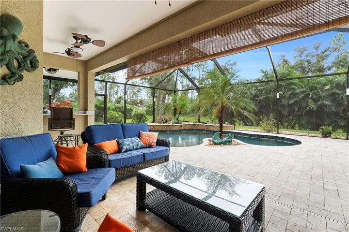 View of patio featuring ceiling fan, an outdoor living space