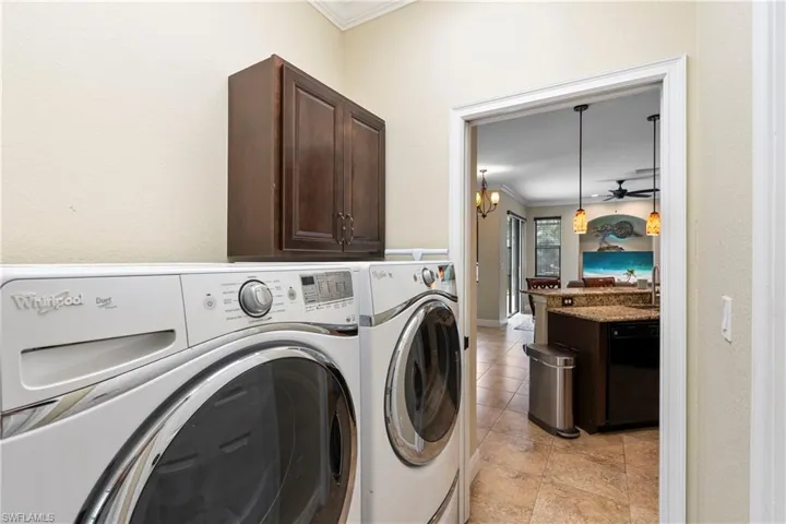 Laundry area with cabinets and washer and dryer