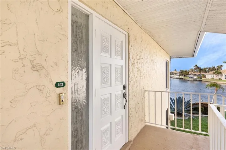 Doorway to property with a water view