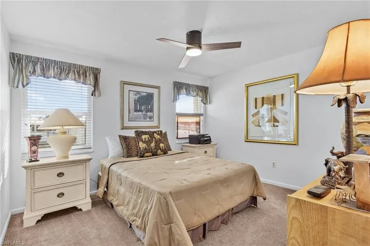 Carpeted bedroom with ceiling fan