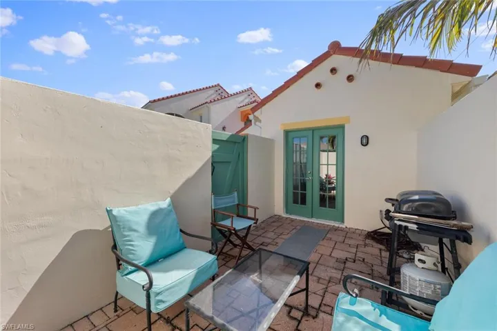 View of patio with fence and french doors