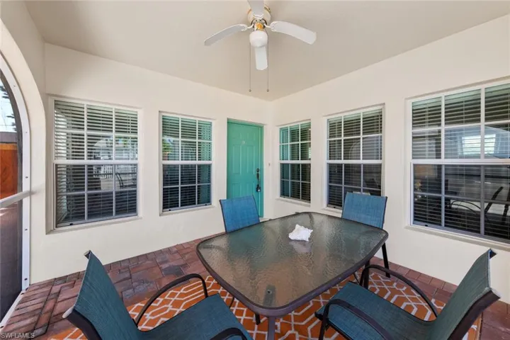 View of patio / terrace with outdoor dining space and ceiling fan