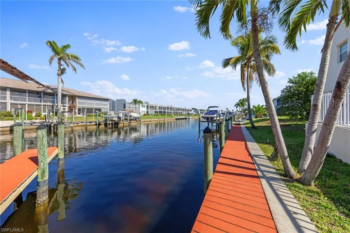Dock area featuring a water view and boat lift