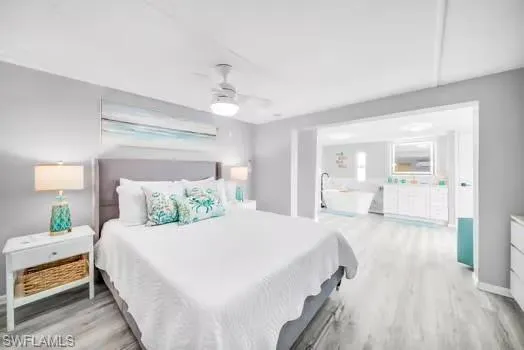 Bedroom with light wood-style flooring and ceiling fan